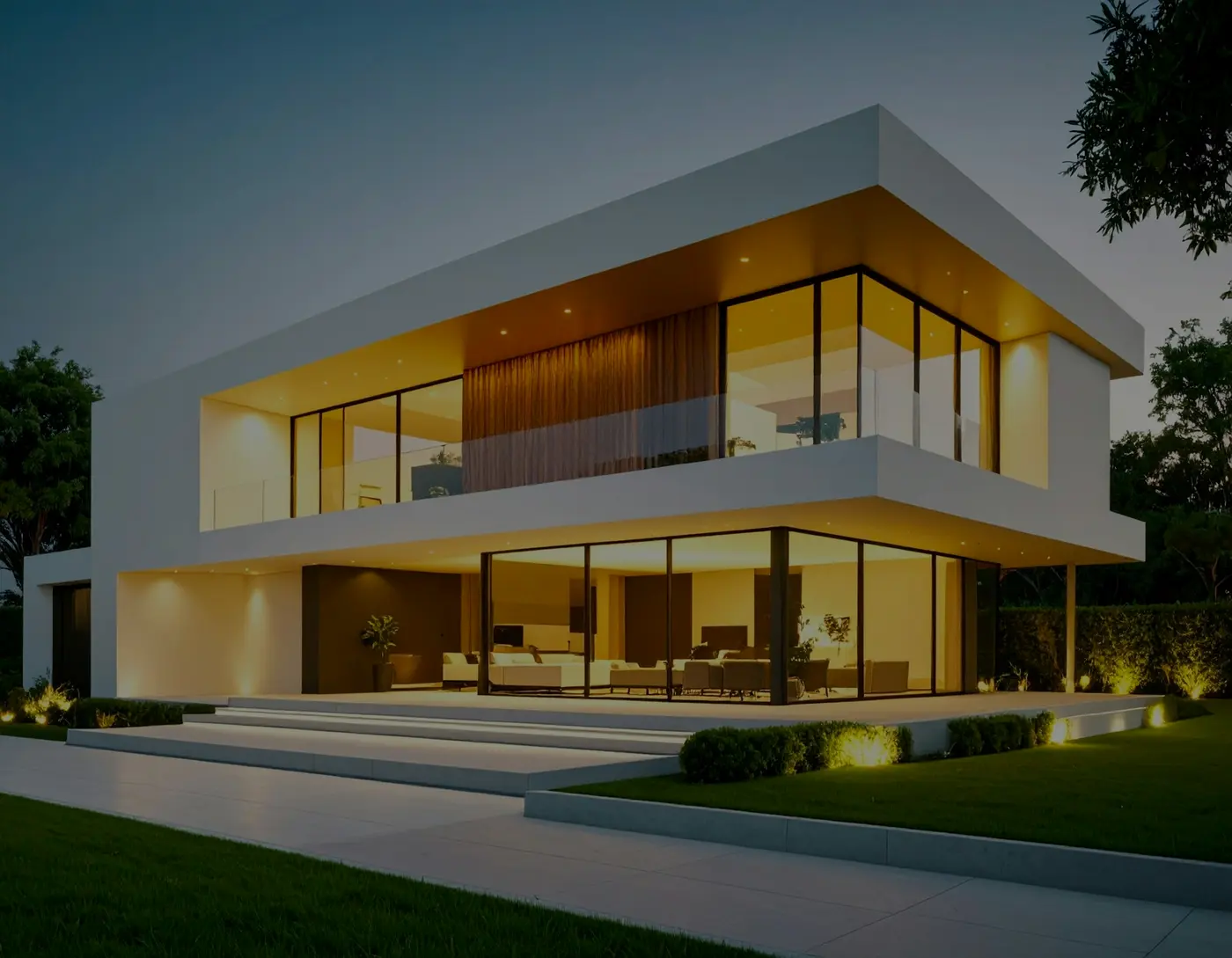 Modern home exterior glowing with warm lights at dusk
